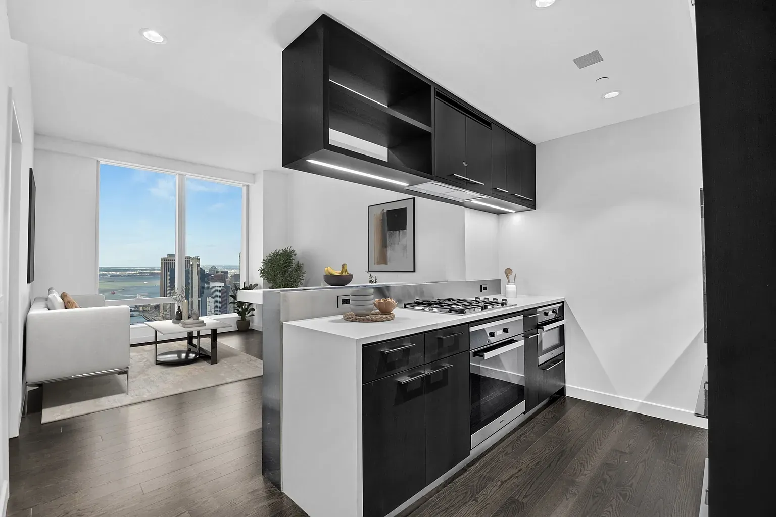Kitchen and living area at One Manhattan Square Residence 49N