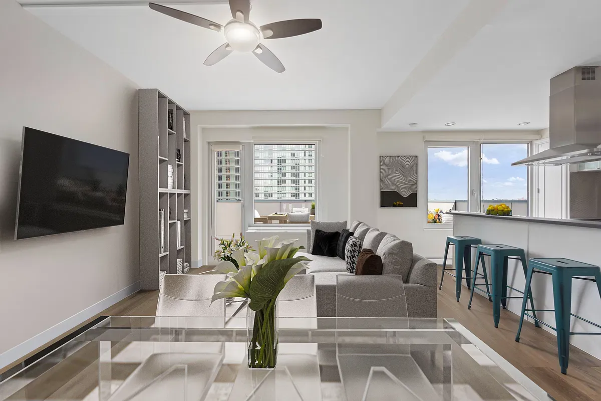 Living and dining area opening to the kitchen in the archived PH15C listing